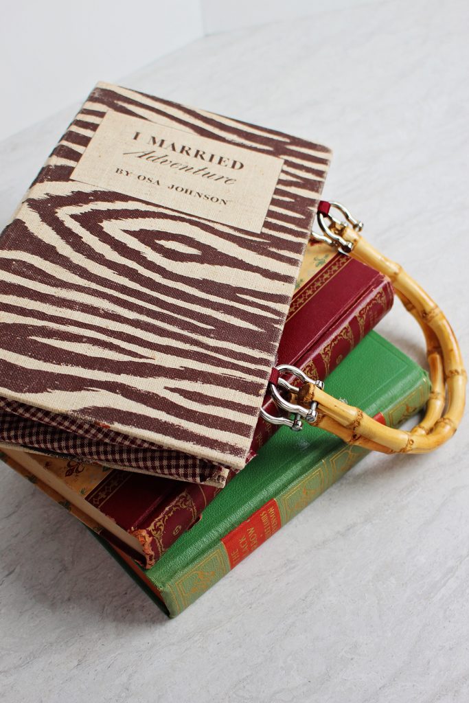 Stack of old books with a Cute DIY Purse made from a Book Cover!