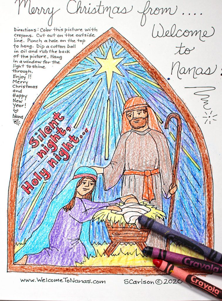 Finished nativity scene coloring page with Mary, Joseph, and baby Jesus. 
