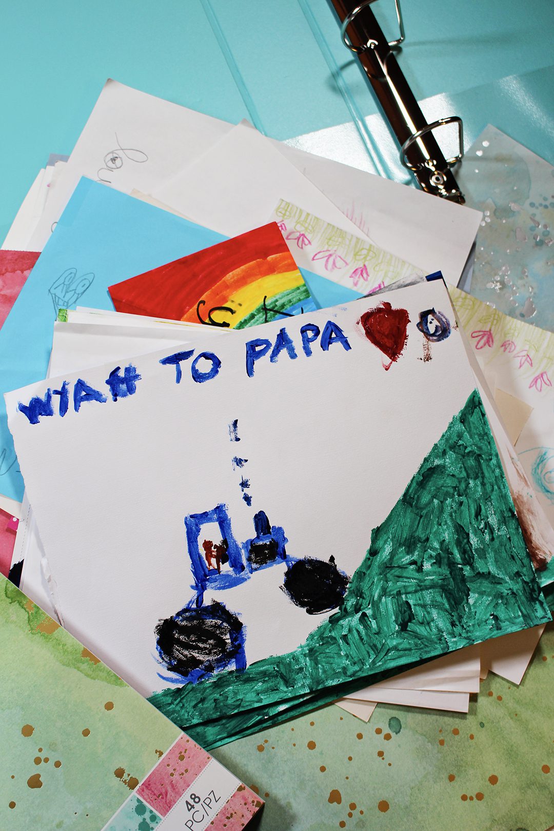 A child's painting of a tractor going up a hill, addressed to Papa.