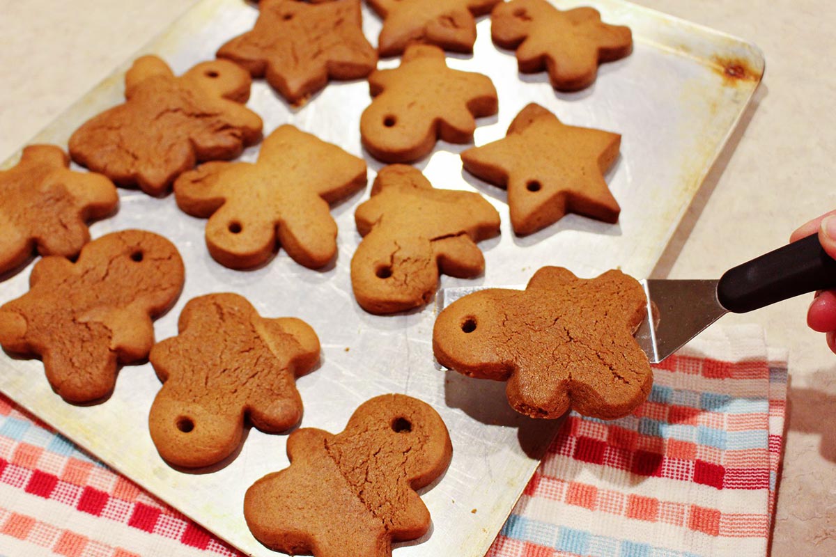 Baked gingerbread men on a baking sheet.