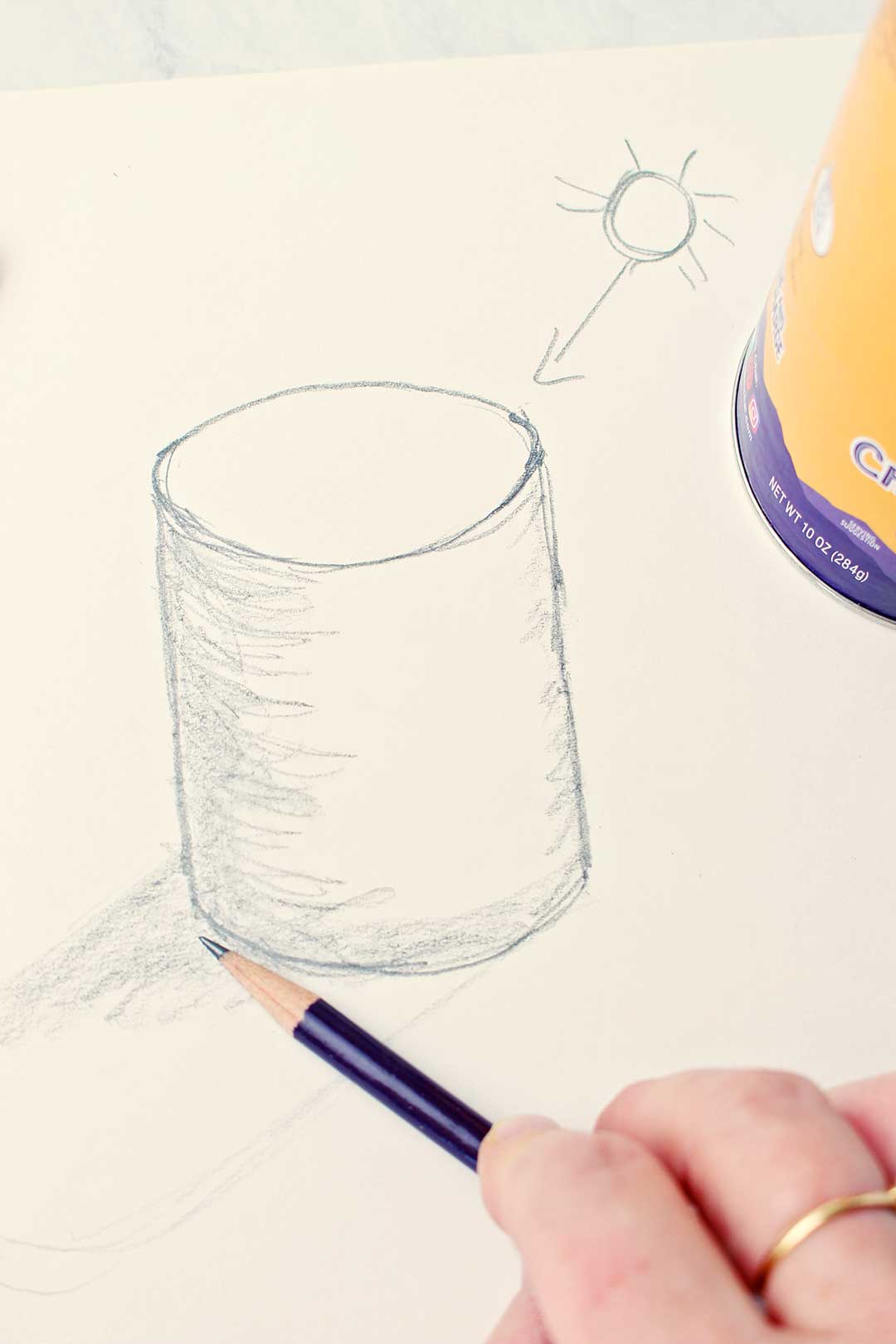 Hand drawing a cylinder with shading.