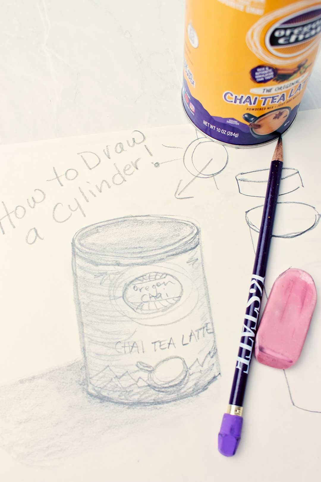 Finished drawing of a Chai Tea Latte container with pencil and pink eraser nearby.