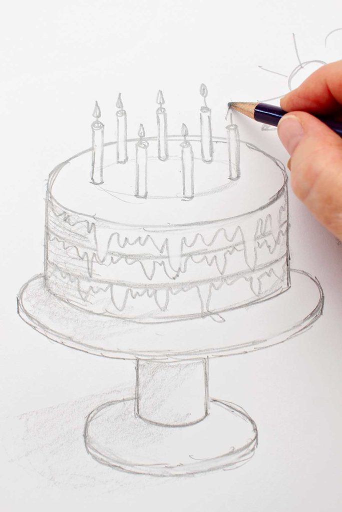 Hand drawing a flame on a candle of a pencil drawn cake.