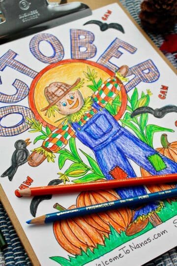 Fully colored coloring page of a scarecrow with pumpkins, crows and the word "October" on top.