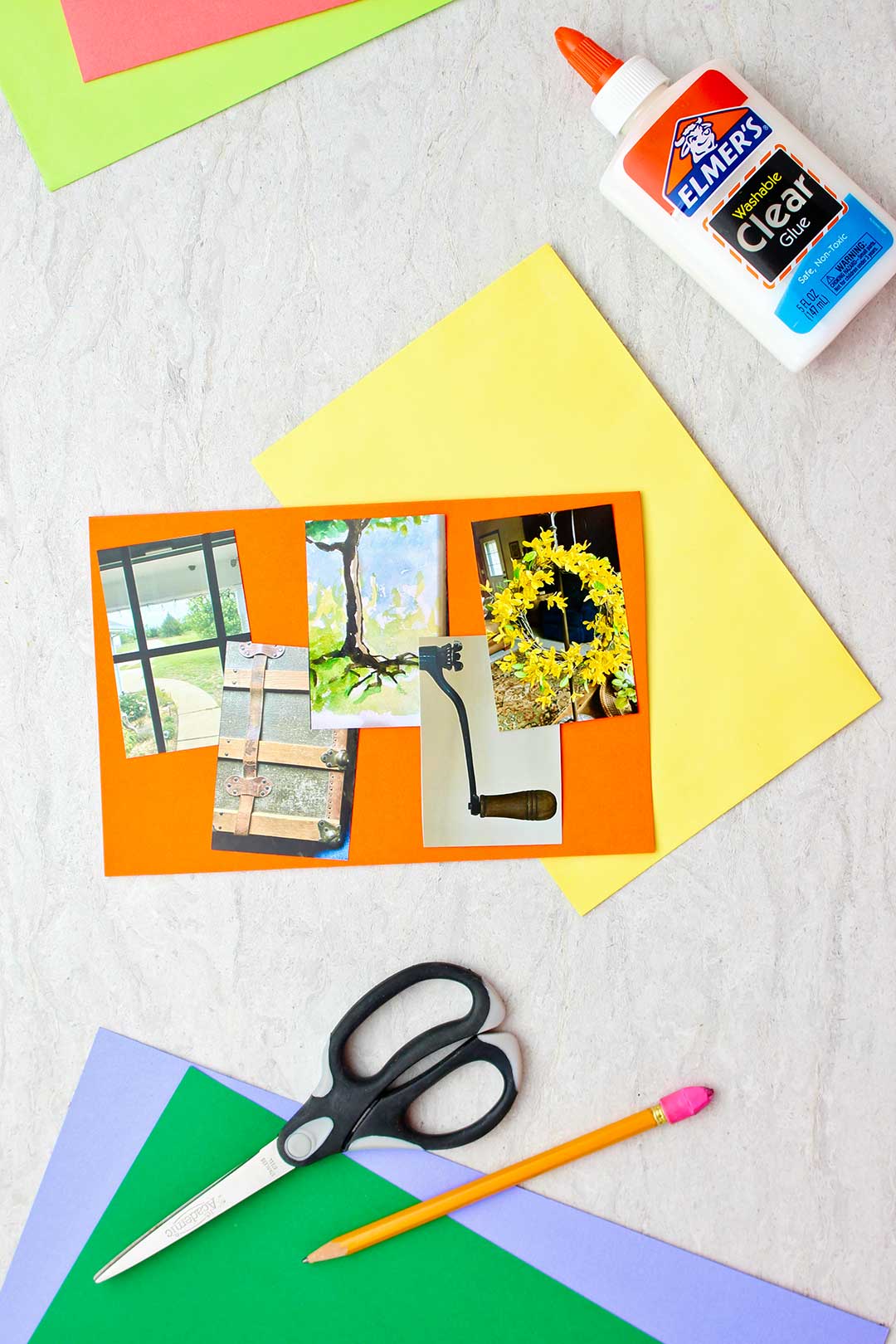 Photo letters spelling "Hello" on orange paper with other supplies near by.