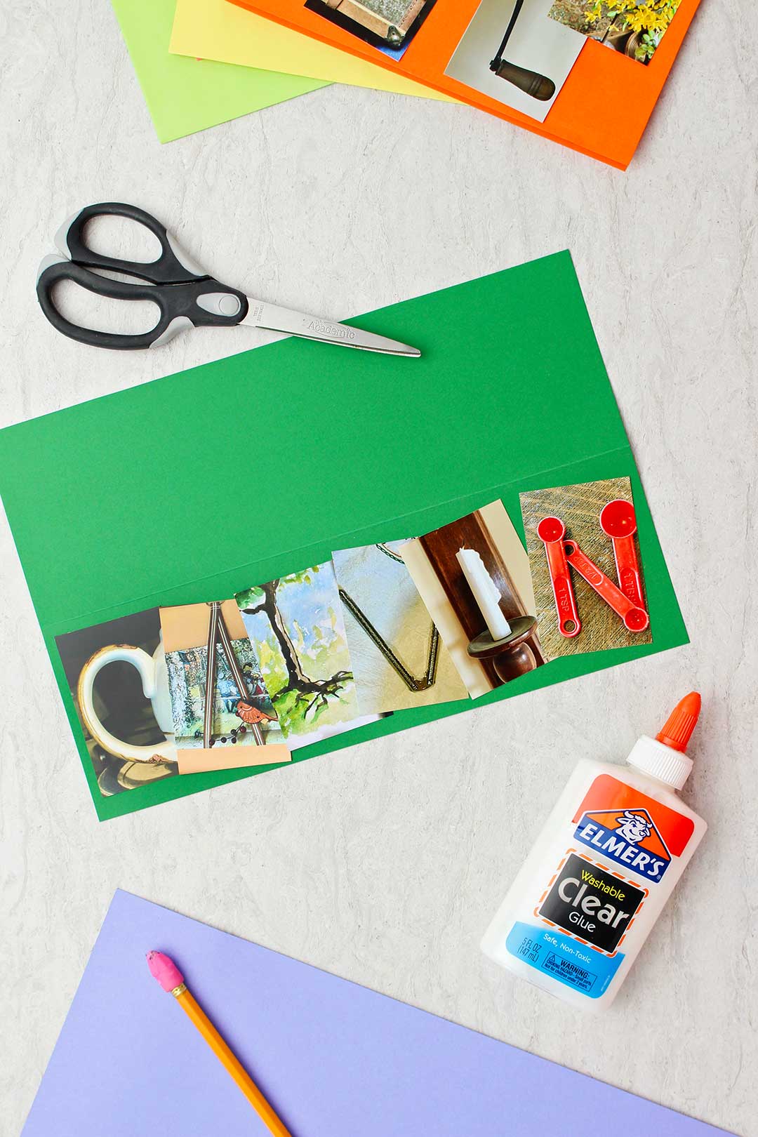 Card on green paper spelling "Calvin" with printed photo letters with colorful paper, scissors and white glue near by.