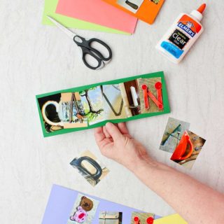 Hand holding card on green paper spelling "Calvin" with printed photo letters.