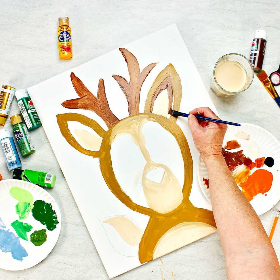 Hand painting ear detail on deer photo frame prop.