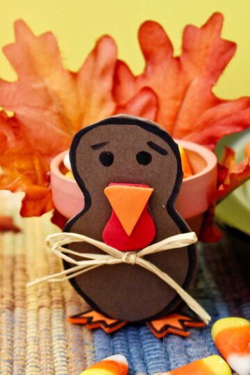 Completed Flowerpot Turkey sitting on a colorful placemat with yellow background.