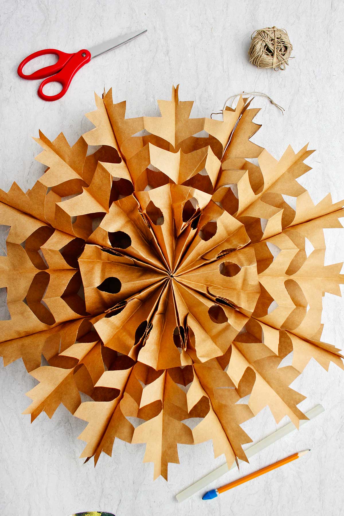 How To Make a Snowflake Out of Paper Bags 12