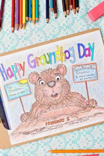 Completed Groundhog Day Coloring Page with colored pencils and pencil sharpener near by.