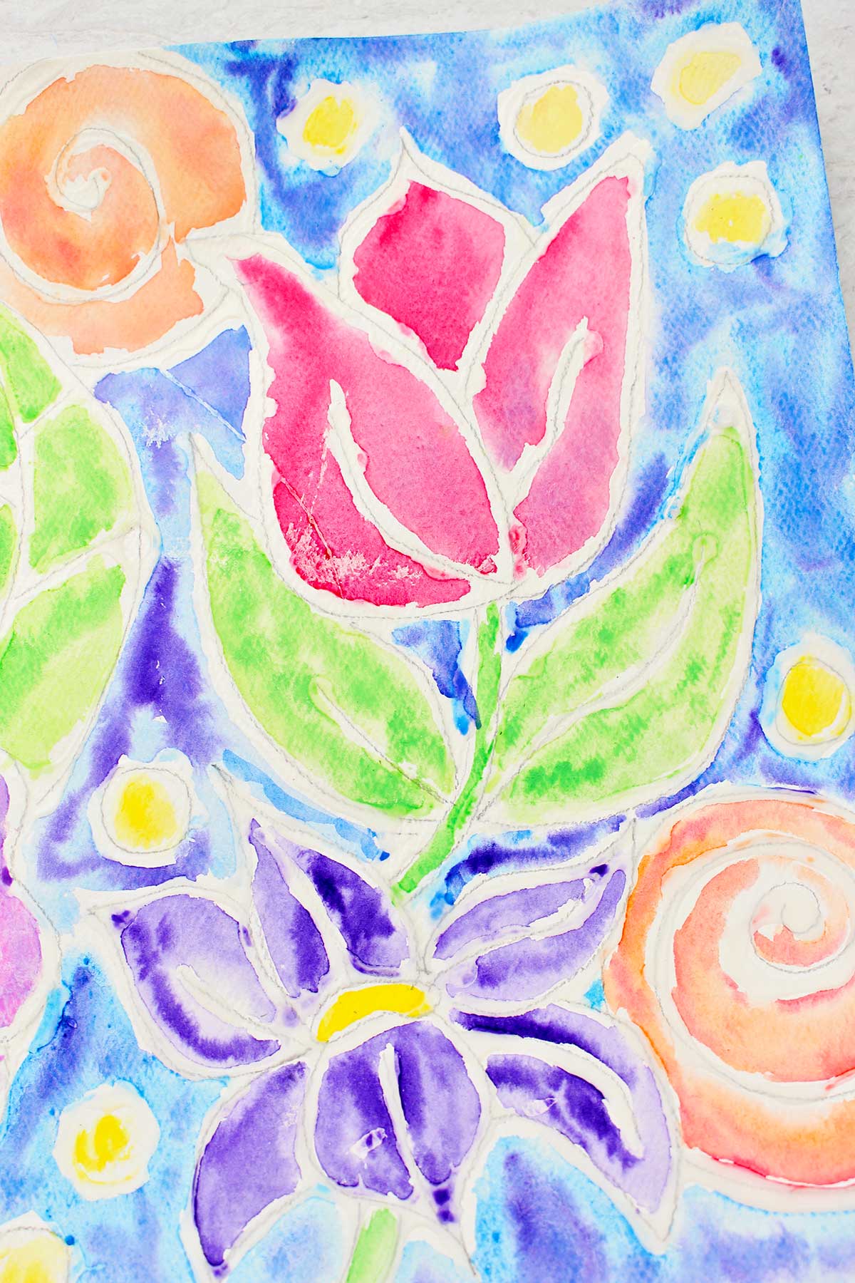 Close up view of a tulip in the glue line painting.