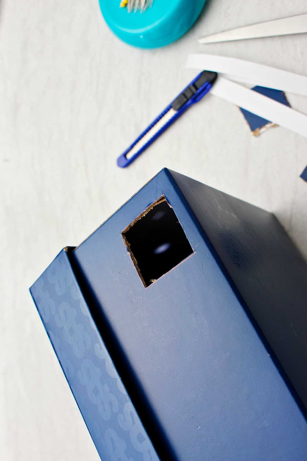 Close up view of the inside of box in completed pinhole projector.