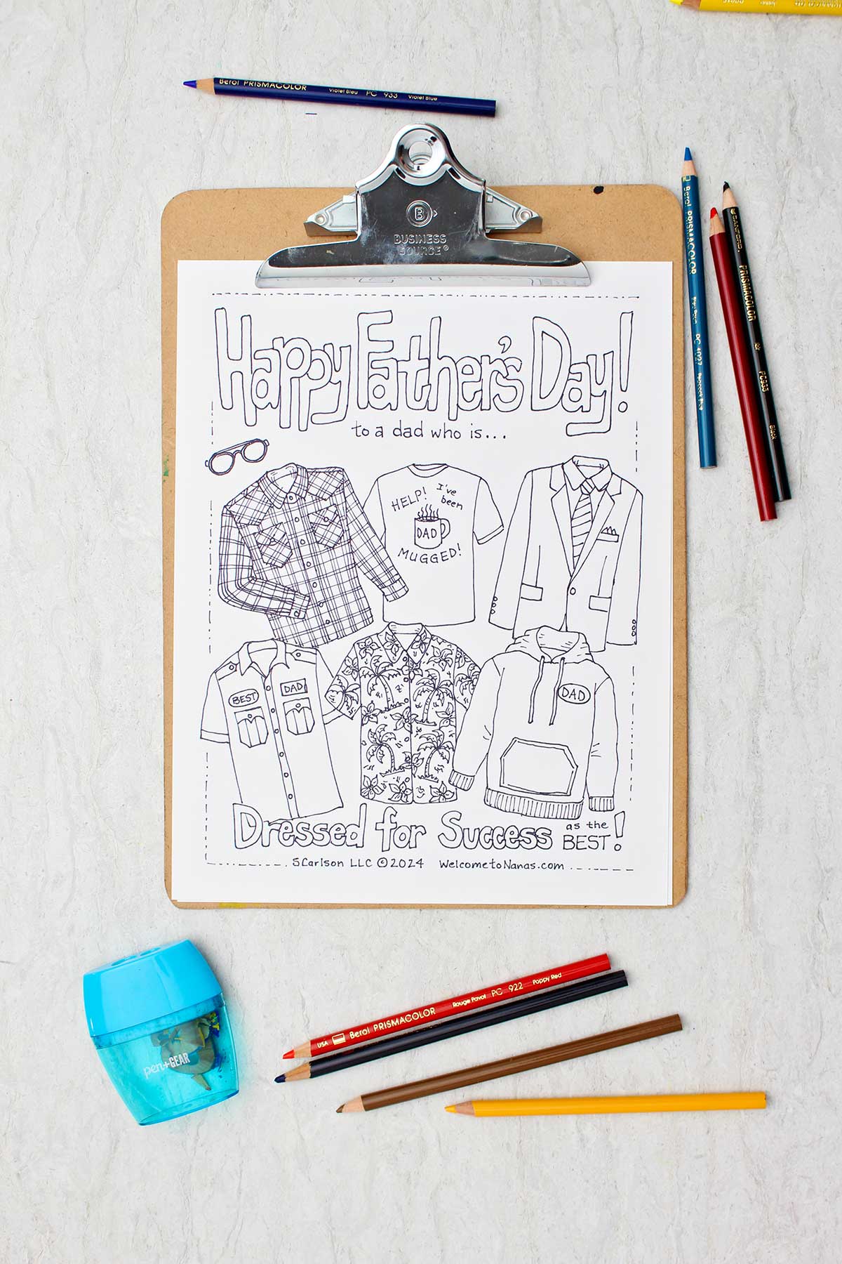 Un colored Father's Day Coloring page on a clip board with colored pencils and a pencil sharpener near by.