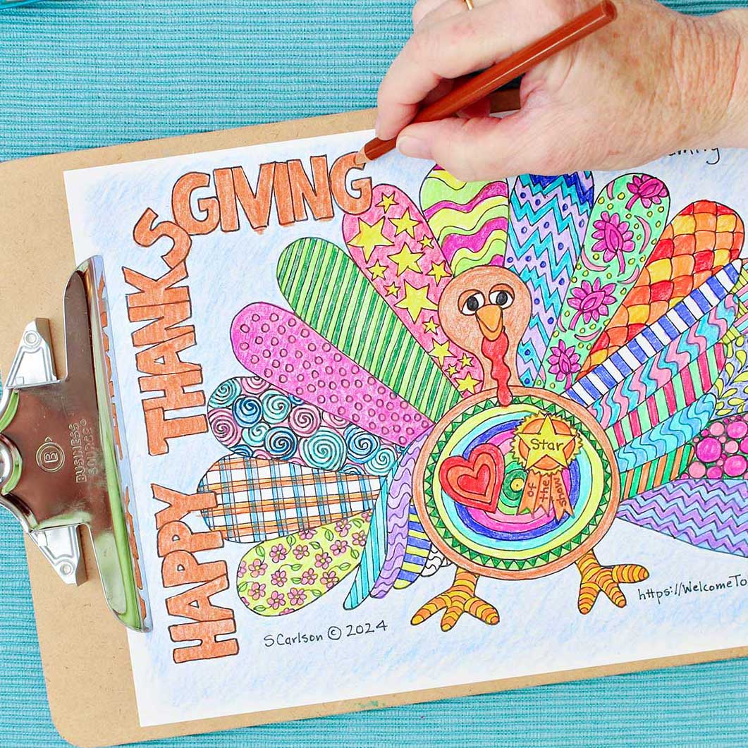 Person coloring "Happy Thanksgiving" orange on Thanksgiving coloring page for kids.