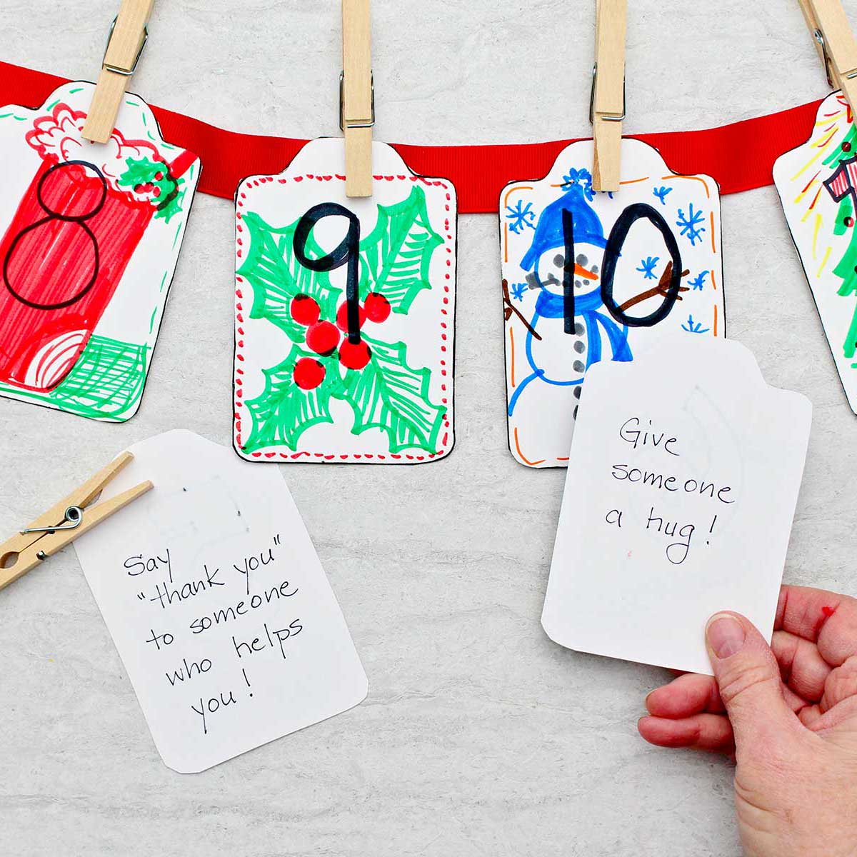 Kindness cards 8, 9 & 10 with festive colorful drawings and a person flipping over two cards to show the kindness instruction on them.