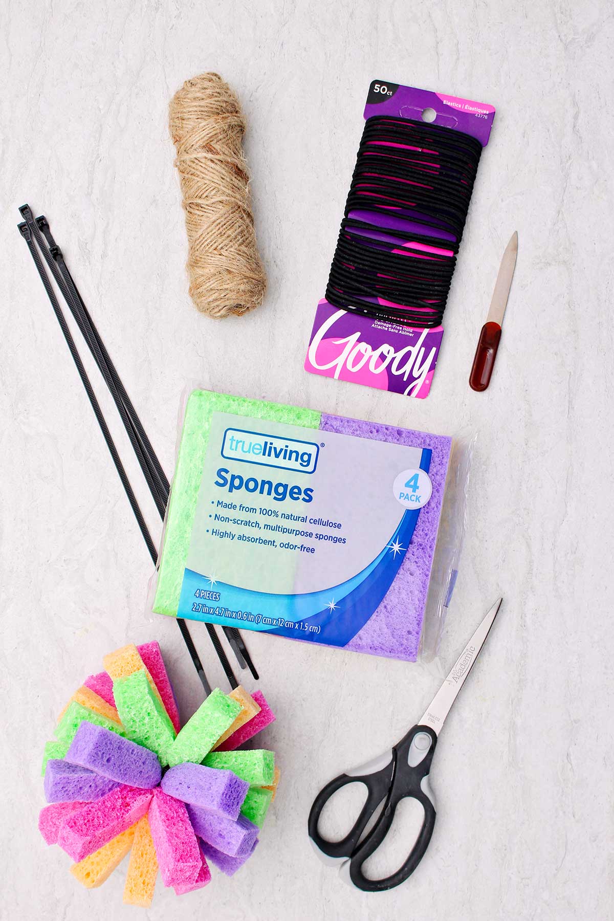 Supplies to make sponge bombs. Hair ties, twine, nail file, zip ties, sponges and scissors.
