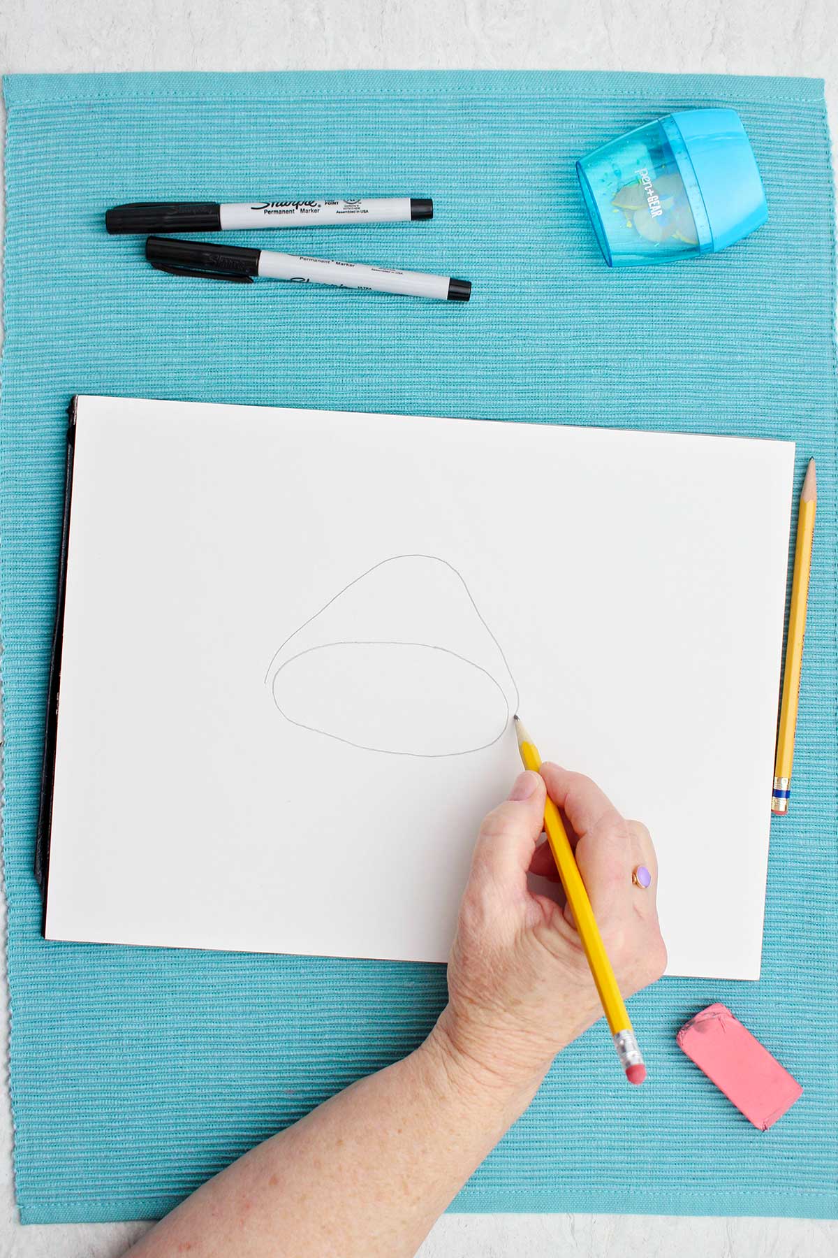 The outline of a mushroom cap on a piece of paper