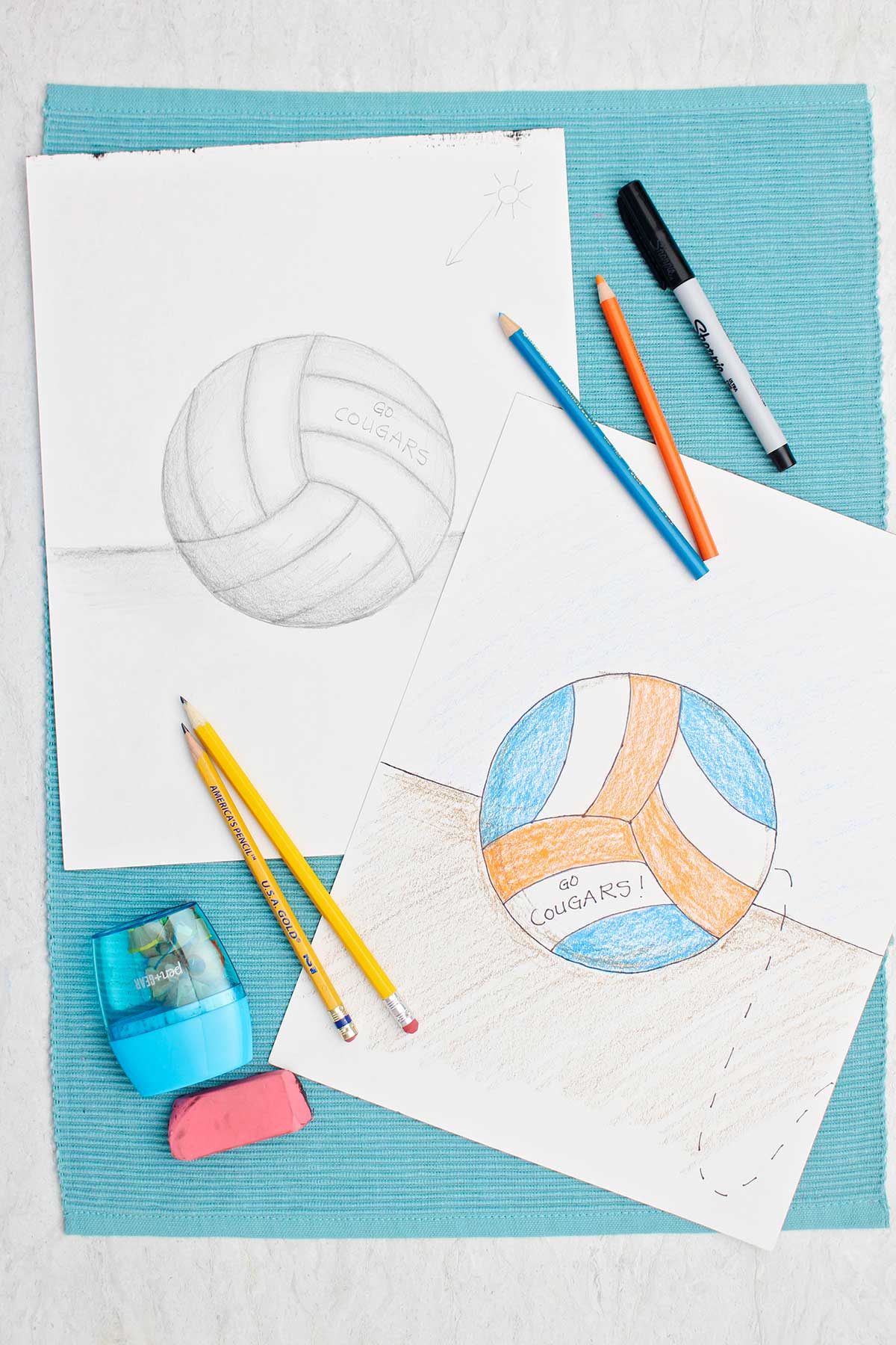 Two drawings of a volleyball. One in pencil with shading and one colored in with blue and orange colored pencil.