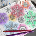 Snowflake coloring page colored with bursts of colored pencil around snowflake shapes.