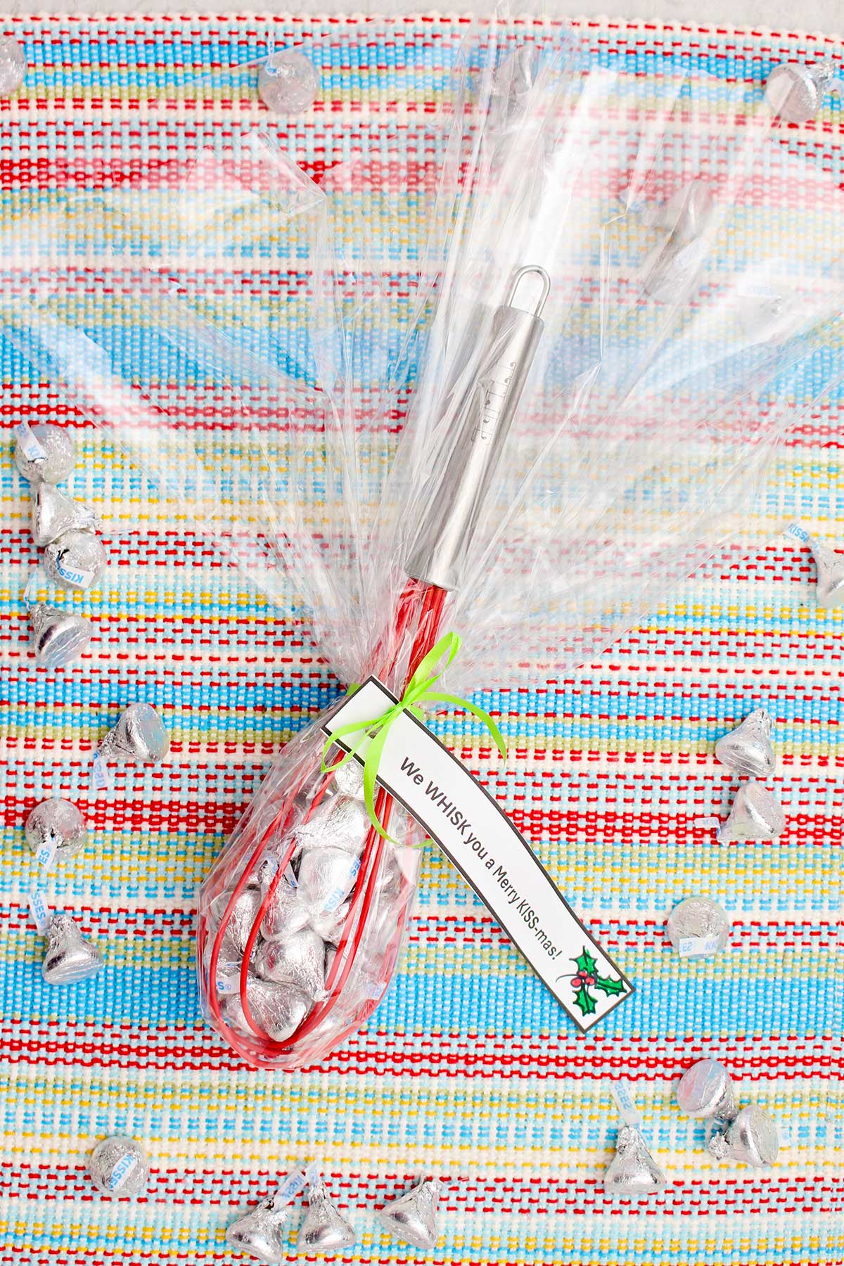 A wrapped and completed whisk candy gift wrapped in cellophane with a little note tied on.