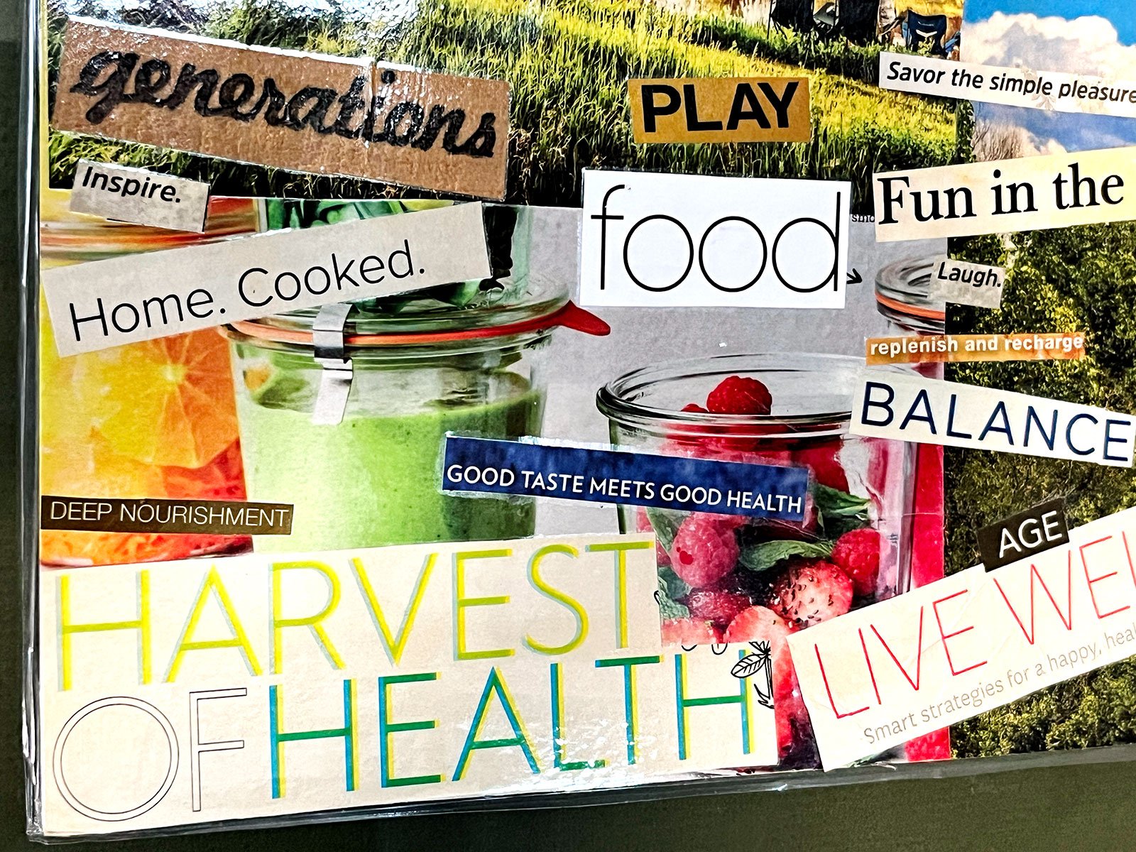 A close up of a magazine clipping vision board with bold text and bright colorful pictures with a theme based on health.