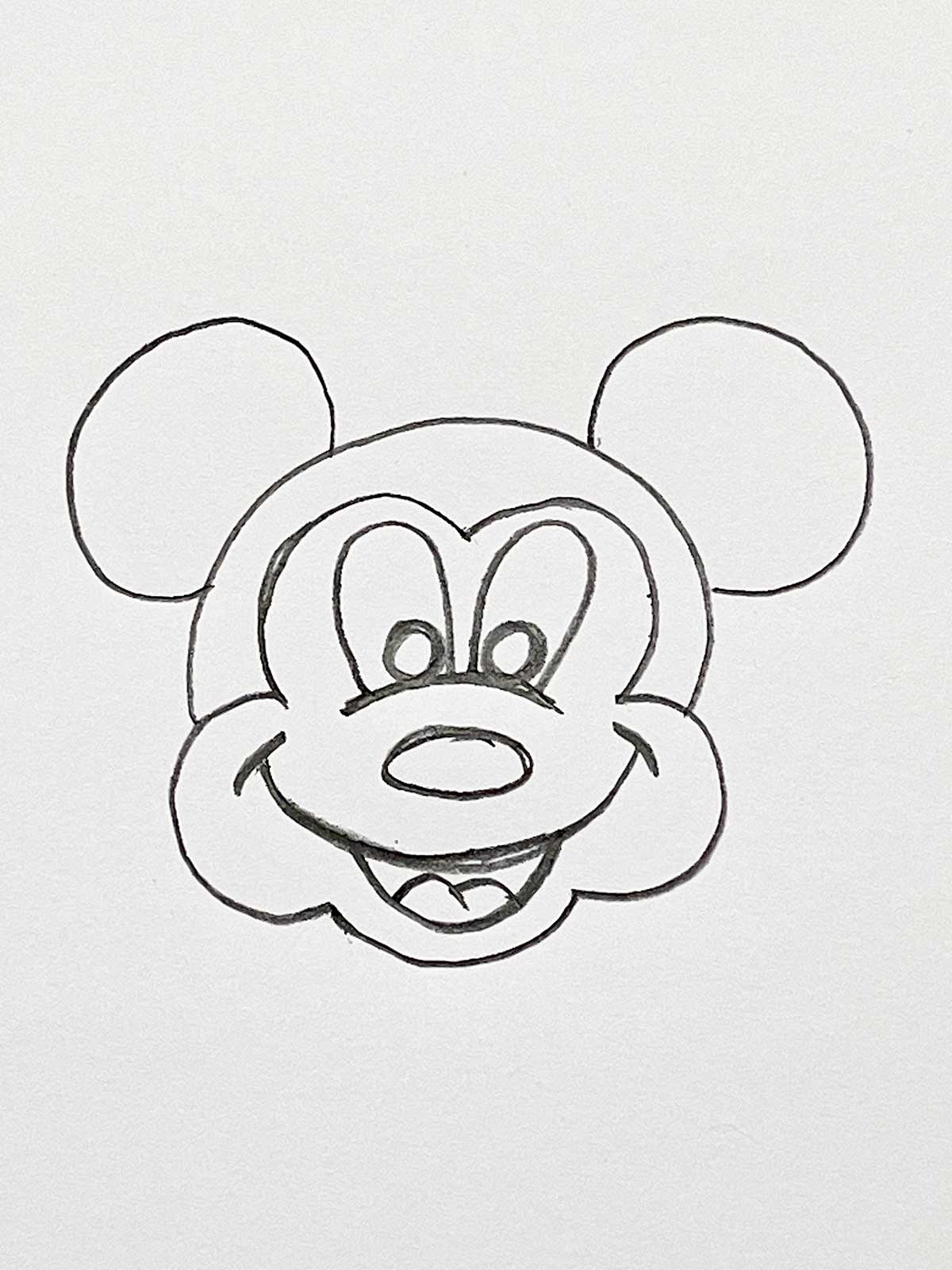 A close up of a Mickey Mouse face.