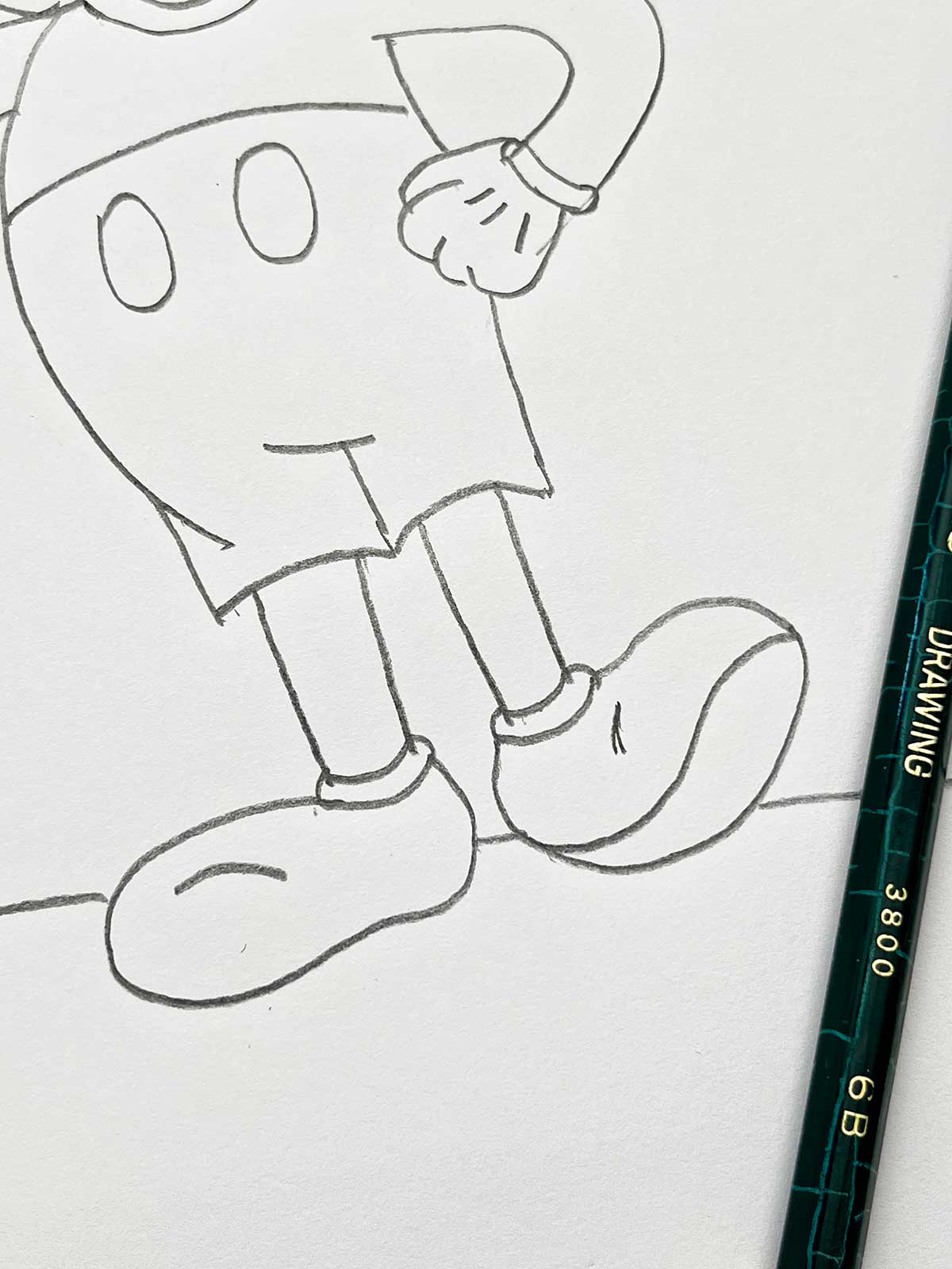 A close up of a pencil sketch of Mickey's feet.