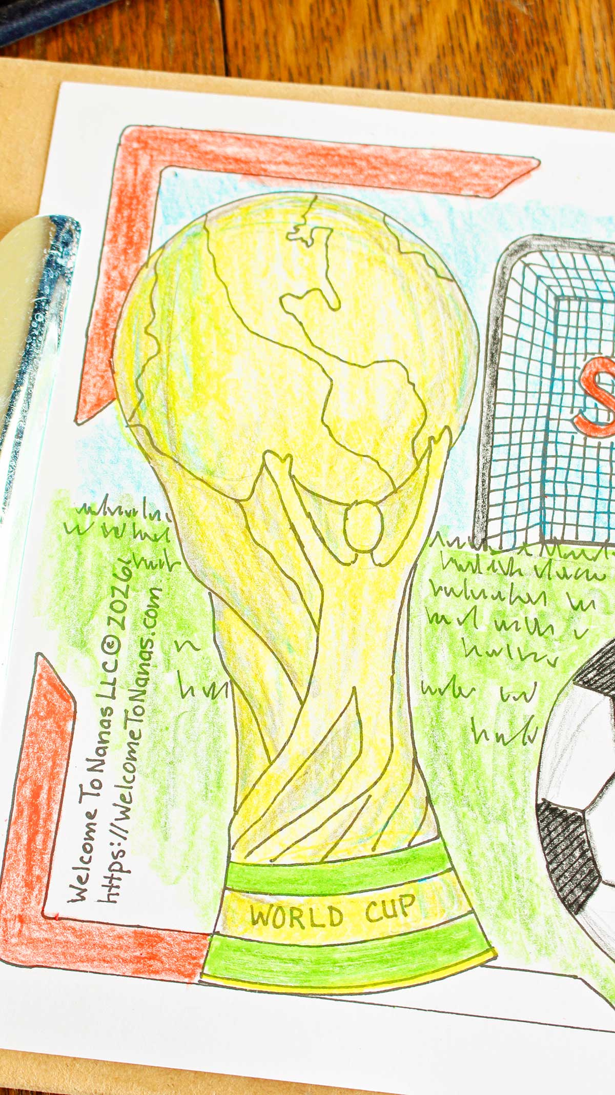 A close up of a trophy on a fully colored in FIFA World Cup coloring page.