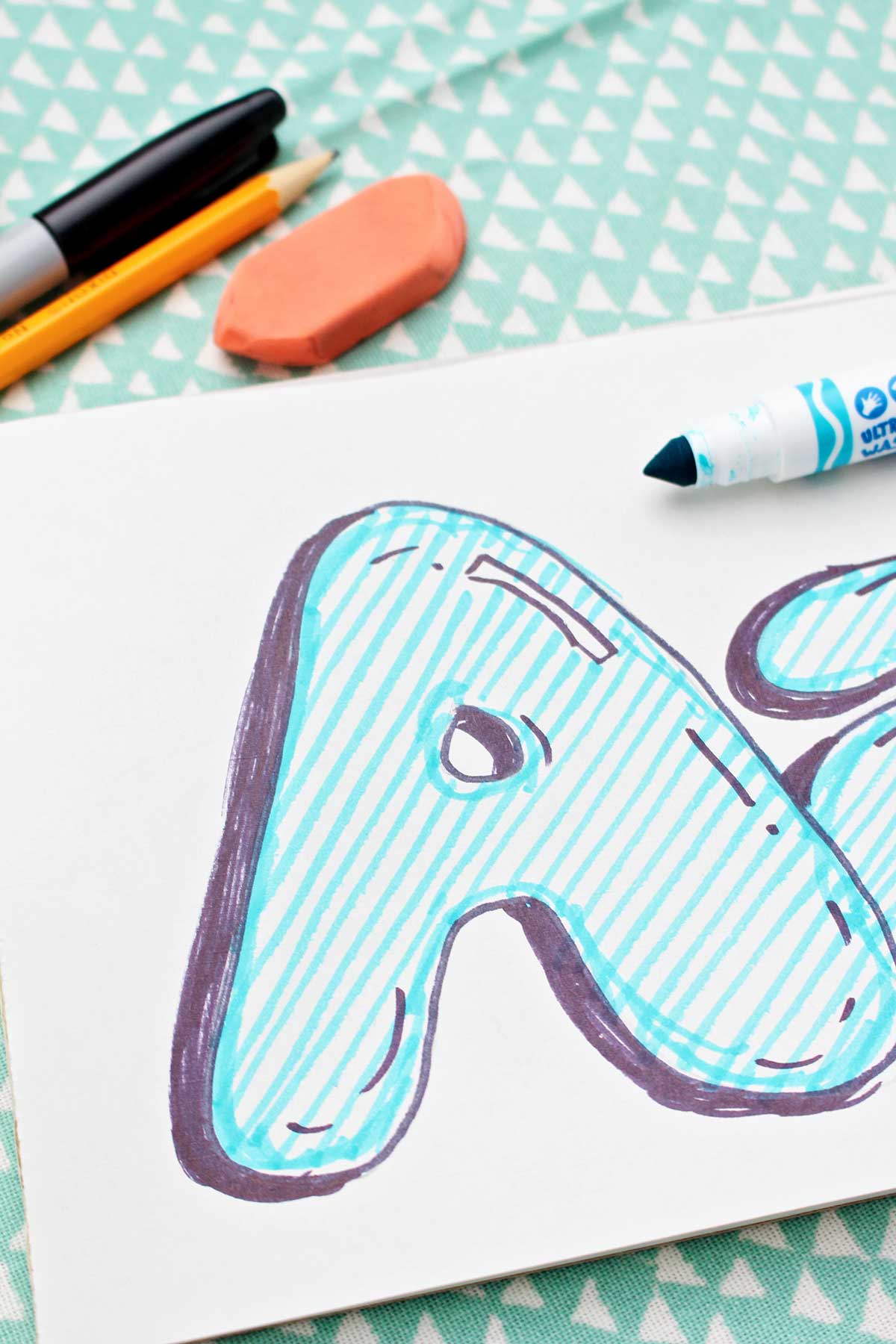 A close up of a completed bubble letter uppercase "a".