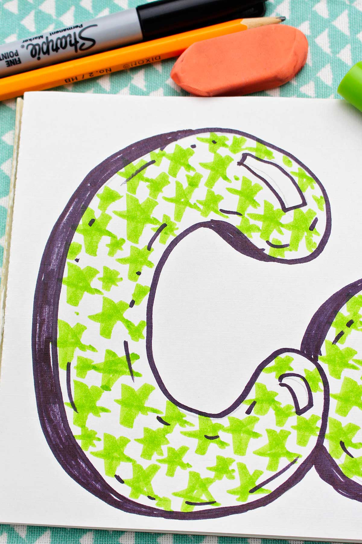 A close up of a completed bubble letter uppercase "c".